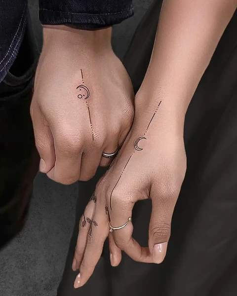 small sun and moon couple tattoo