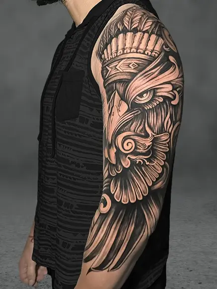 A detailed eagle tattoo on a male upper arm and shoulder