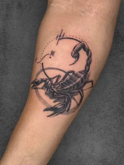 A realistic black and grey tattoo of a scorpion with fine details and astrological symbols, showcasing strength and determination, created by a student of the Complete Course in Tattoo
