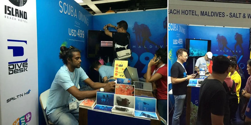 Dive Desk representatives with Island Beach House team at MIDE 2016 in Kuala Lumpur, showcasing Maldives diving opportunities.