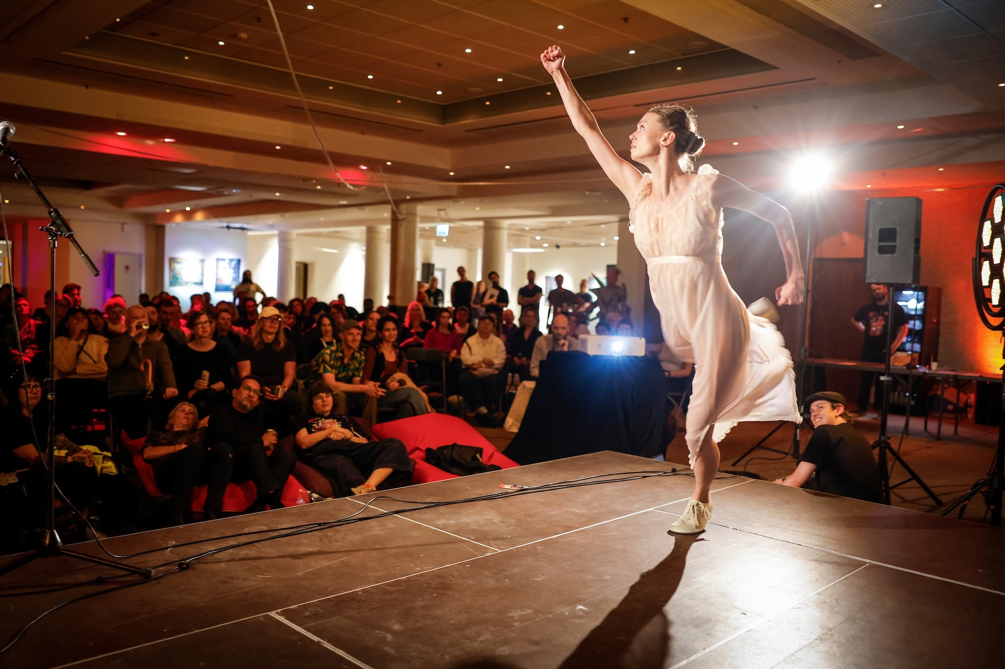 A performer onstage in front of an audience at Gothenburg Fringe