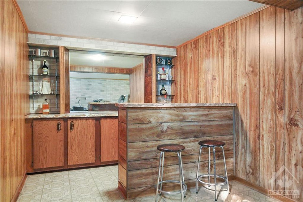 The original bar area of the basement. Lots of wood paneling.