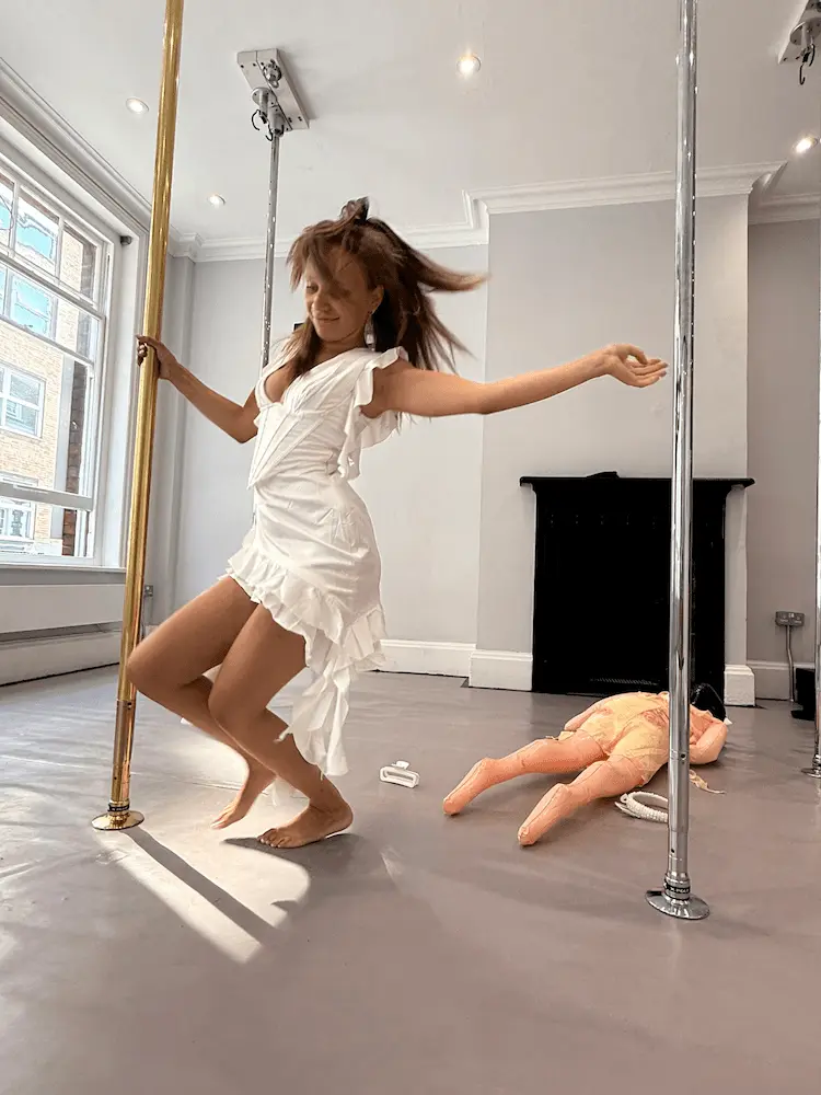 Bride spinning on the pole during her London bachelorette party at Pole Mission Soho
