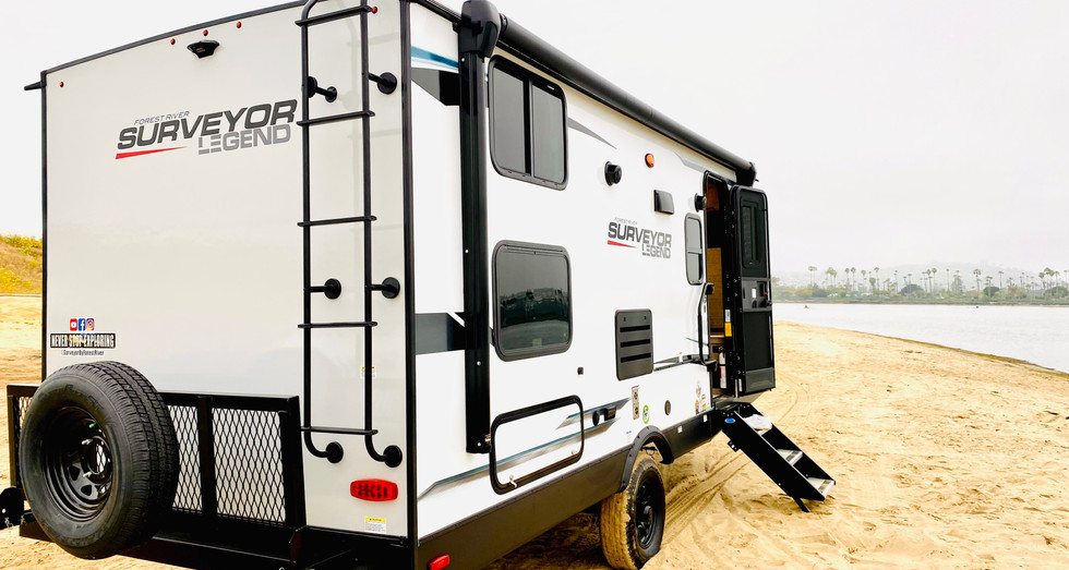 Legend Brownie travel trailer parked at a scenic campsite, ideal for long-term stays