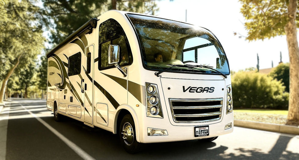 Thor Vegas motorhome driving under California trees.