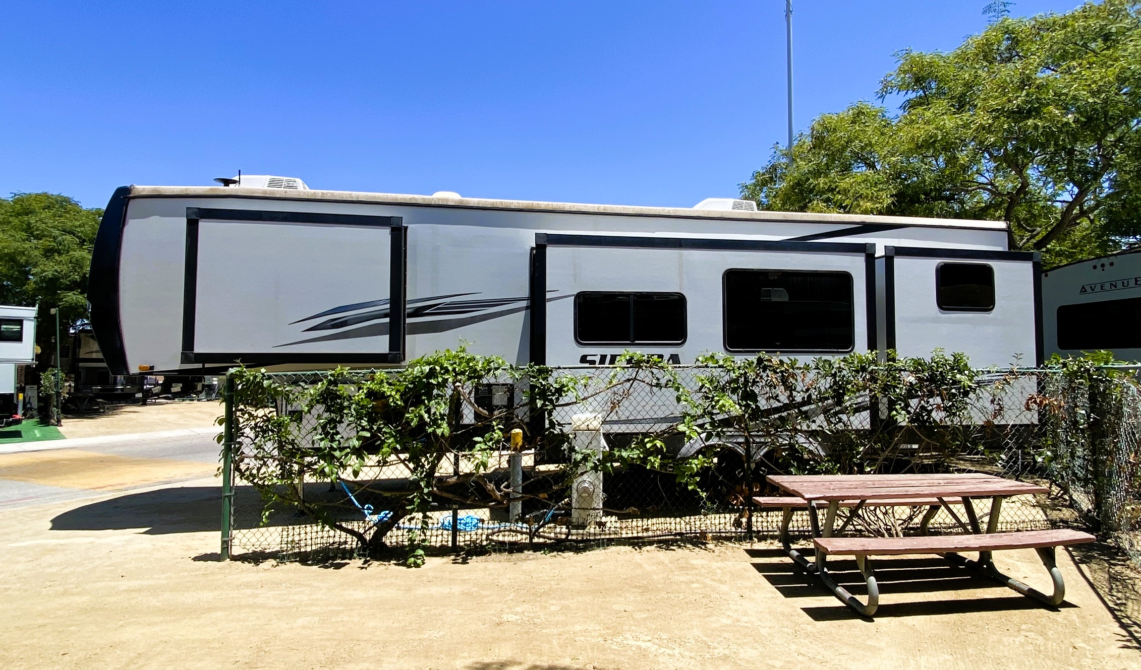 Sierra Fudge travel trailer fully set up at Newport Dunes in Newport Beach