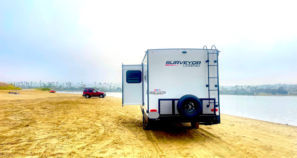 Rear view of the Legend Brownie travel trailer with a sturdy frame and convenient access