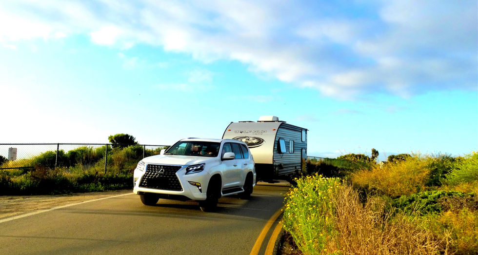Ultralight Tart travel trailer hitched to an SUV, smoothly towing on the highway