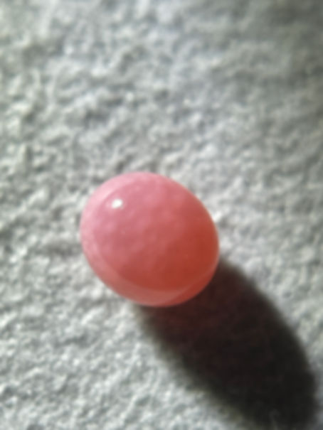 0.7 Carat Natural Pink Conch Pearl – Oval Shape, 4.3 x 5.0mm, Fair Flame