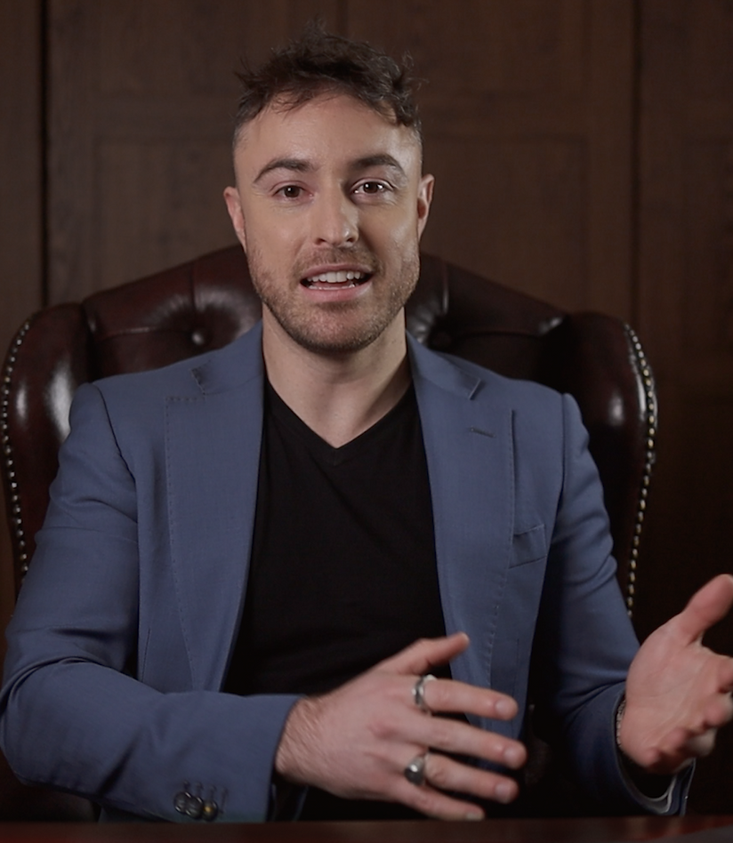 photo of jared kirkwood, a young professional in a suit educating