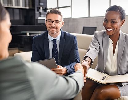 People reaching agreement at the end of a business meeting