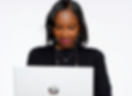 Shay Smith holding an HP laptop, representing a professional and tech-savvy approach to branding and graphic design.