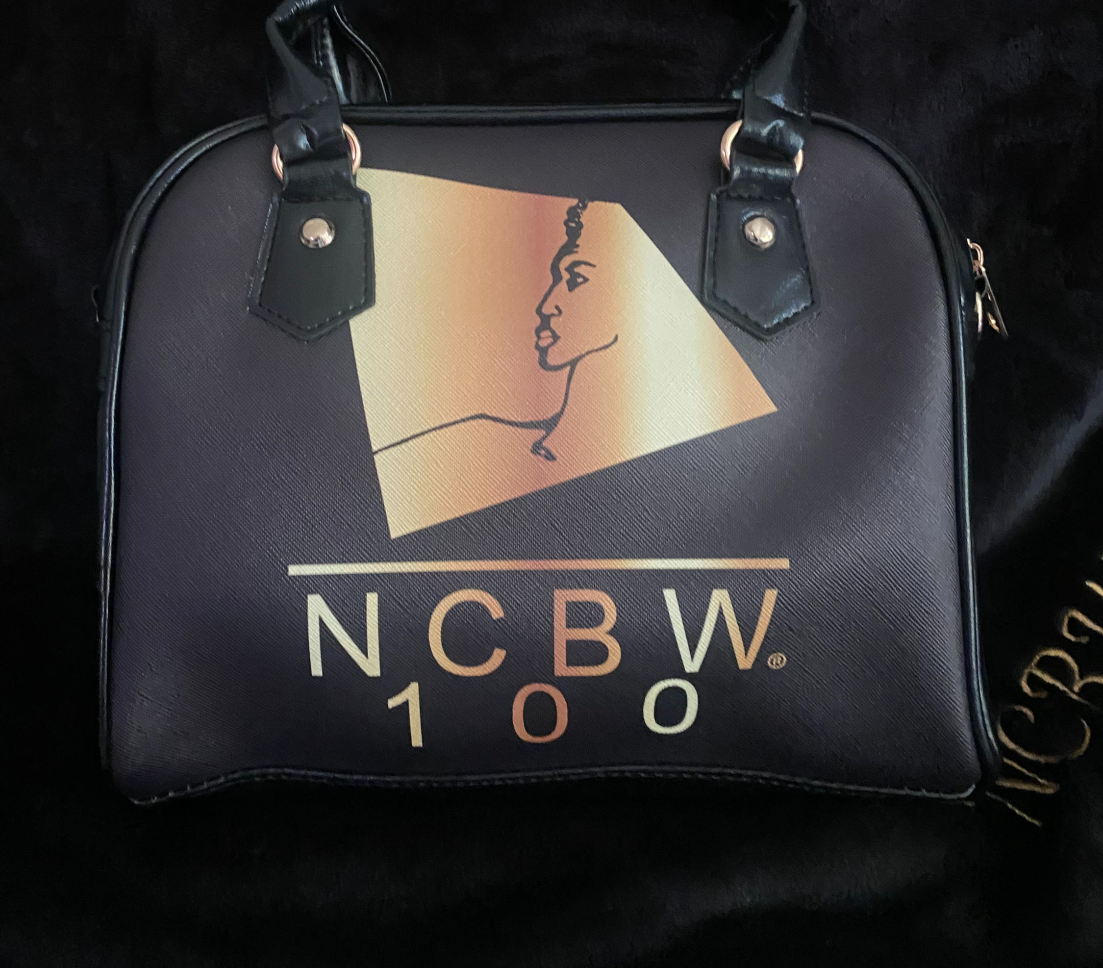 Hand carry and shoulder purse with NCBW Logo