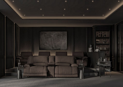 a dark room with a couch and a painting on the wall