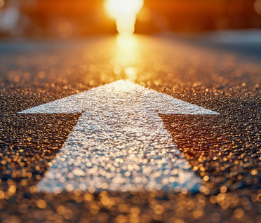 vecteezy_close-up-of-arrow-painted-on-asphalt-road-surface-leading_72455086.jpg