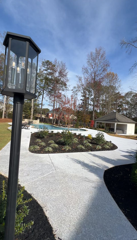 concrete pathway with pool lighting for a custom pool in tyrone, georgia