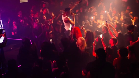 Yxng Bane on stage with the crowd at a Hypent Group show