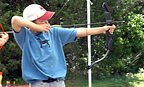 young man firing an arrow