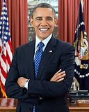 Barack Obama smiling in the Oval Office