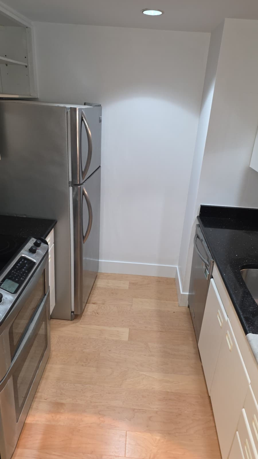 Modern hardwood floor installation in a high-rise Boston condo overlooking Mass Ave.