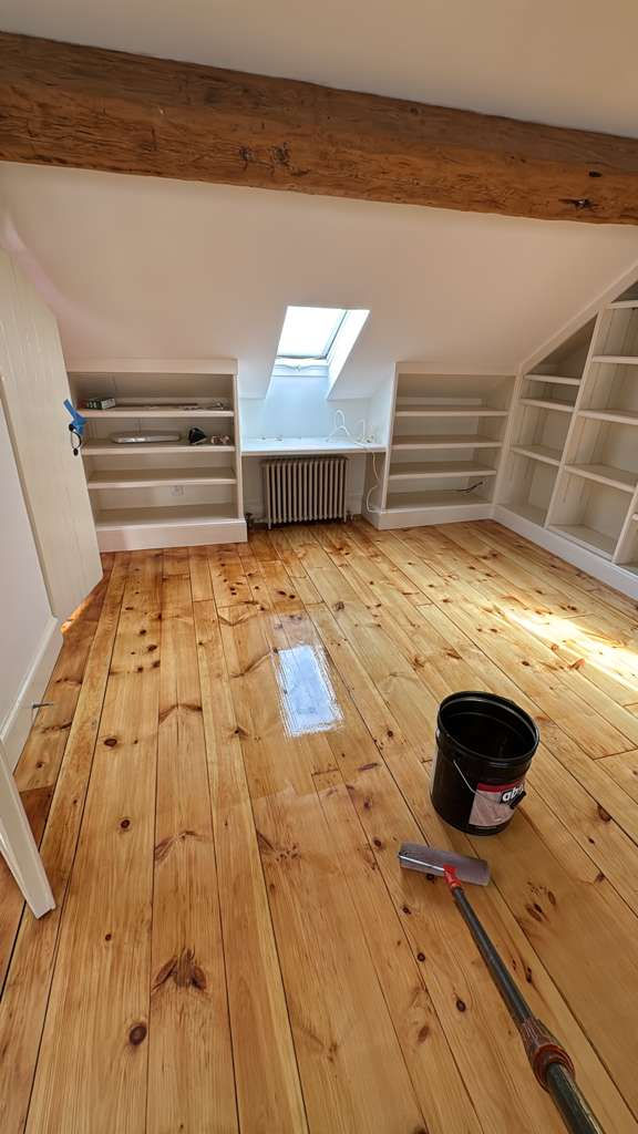 Refinished pine wood floors in Downtown Boston with 3 coats of Absco finish.