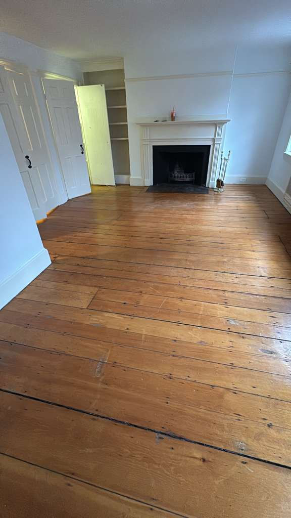 Refinished pine wood floors in Downtown Boston with 3 coats of Absco finish.