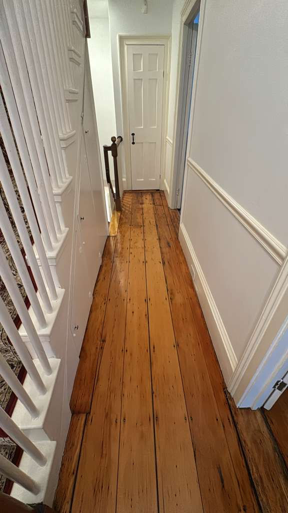 Refinished pine wood floors in Downtown Boston with 3 coats of Absco finish.