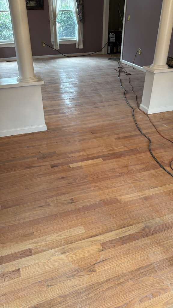 Completed MSI Kings Buff Oak hardwood floor installation in a Framingham, MA living room.