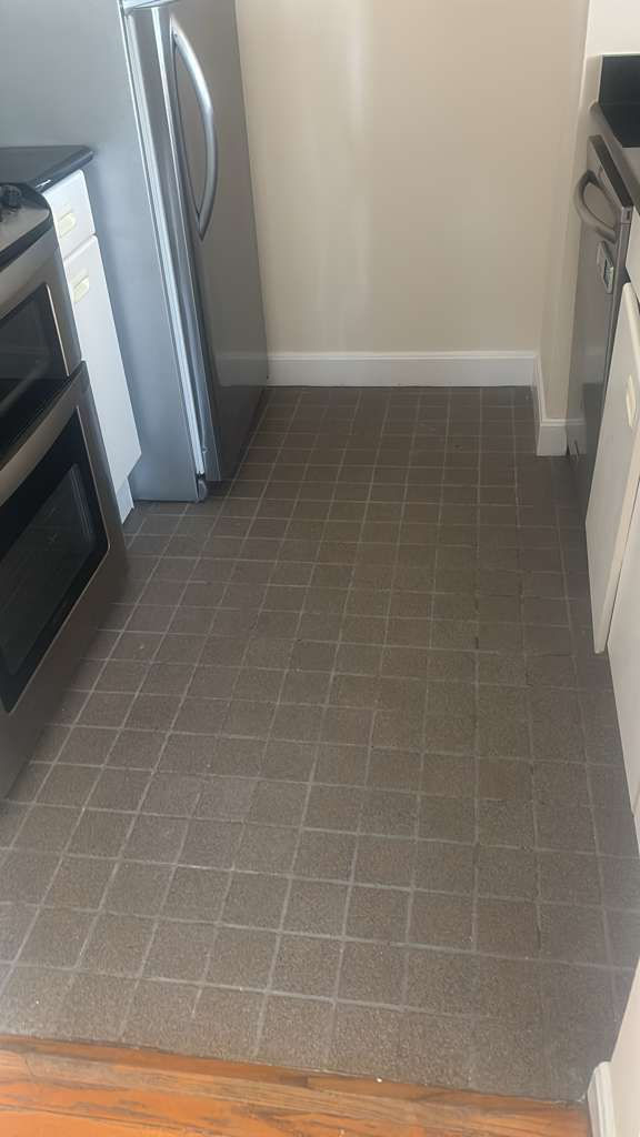 Modern hardwood floor installation in a high-rise Boston condo overlooking Mass Ave.
