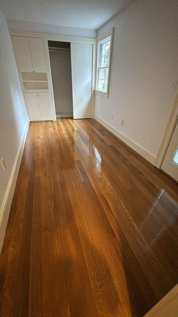 Polished wooden floor in an empty room.