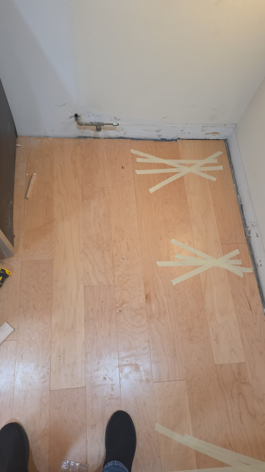 Modern hardwood floor installation in a high-rise Boston condo overlooking Mass Ave.