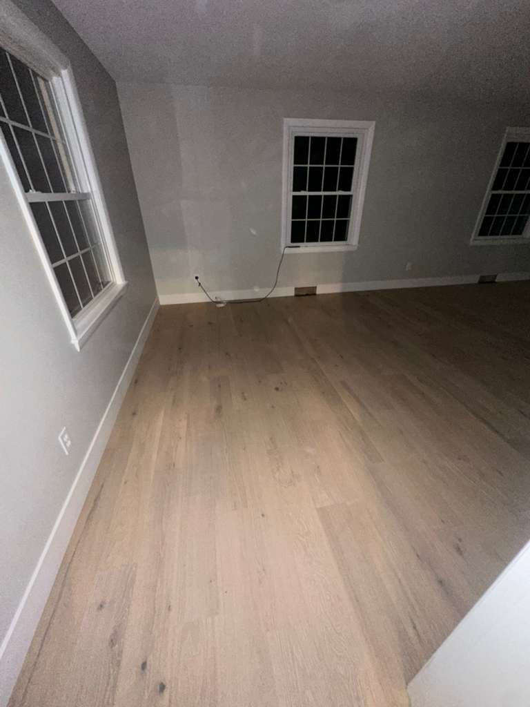 Modern MSI Bali Buff hardwood installation throughout a North Andover MA living room