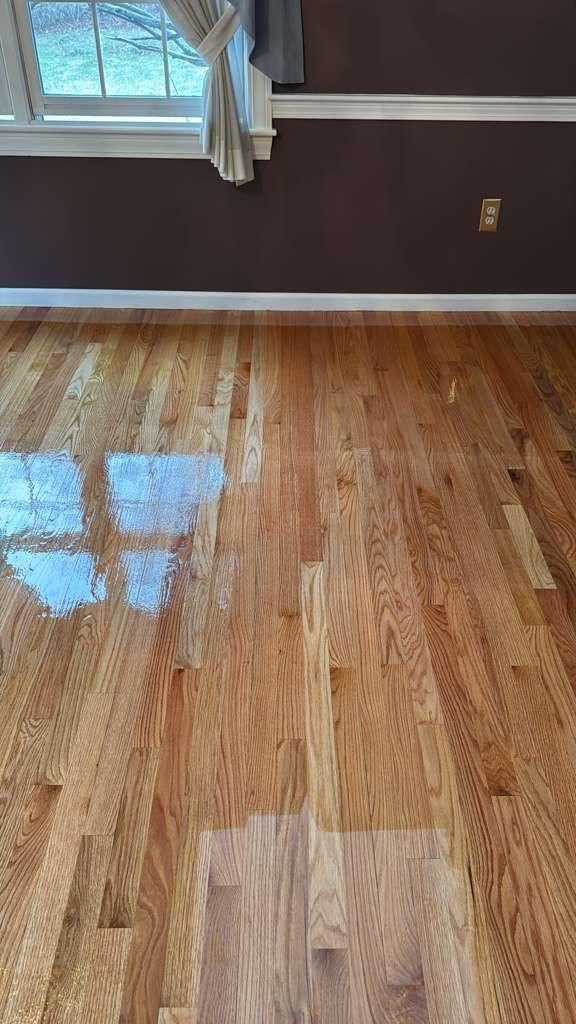 Completed MSI Kings Buff Oak hardwood floor installation in a Framingham, MA living room.