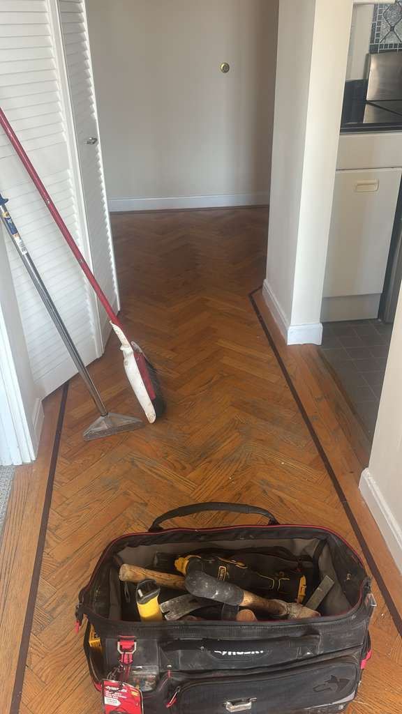 Modern hardwood floor installation in a high-rise Boston condo overlooking Mass Ave.