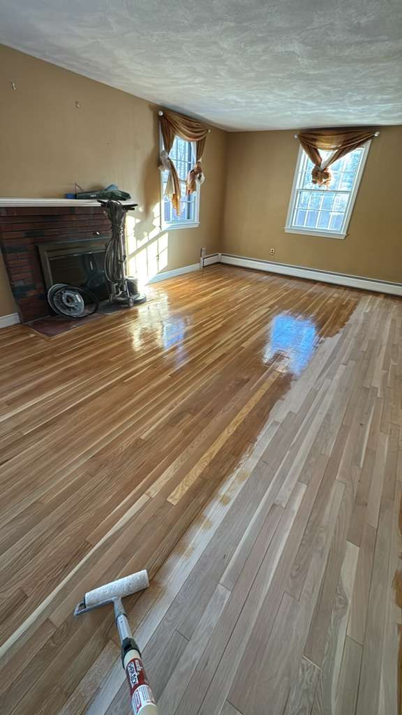 Smooth, restored hardwood floor after professional refinishing service in a Billerica MA home.