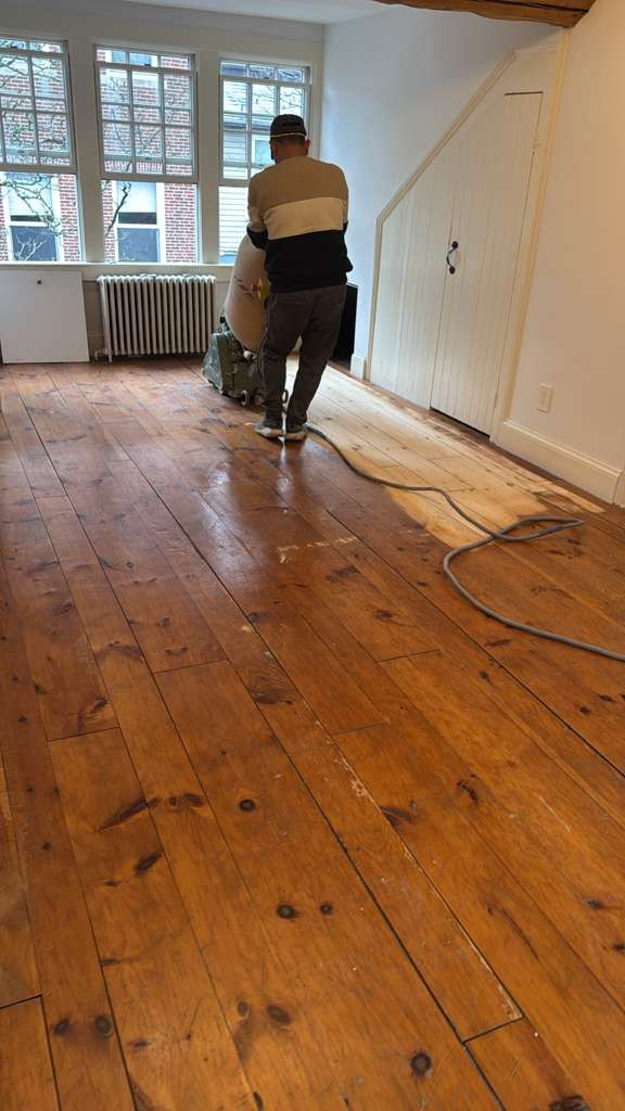 Refinished pine wood floors in Downtown Boston with 3 coats of Absco finish.