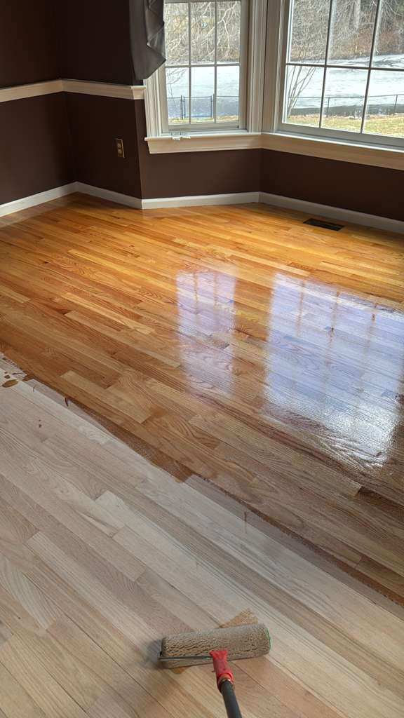 Completed MSI Kings Buff Oak hardwood floor installation in a Framingham, MA living room.