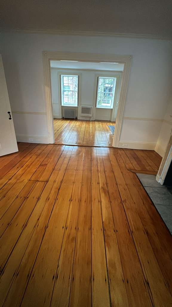 Refinished pine wood floors in Downtown Boston with 3 coats of Absco finish.