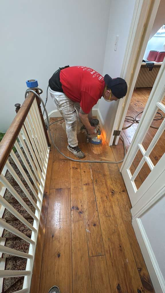 Refinished pine wood floors in Downtown Boston with 3 coats of Absco finish.