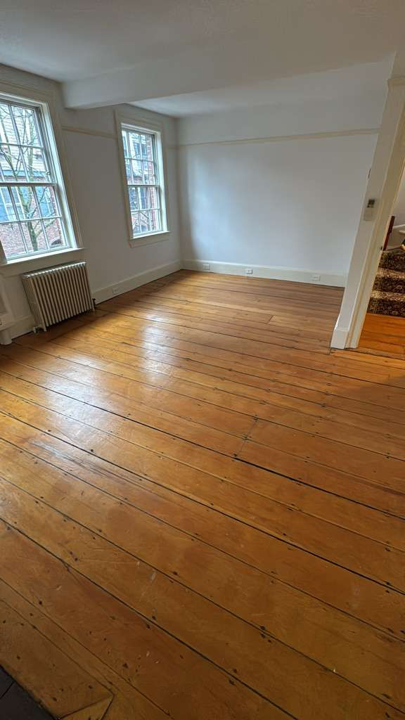 Refinished pine wood floors in Downtown Boston with 3 coats of Absco finish.