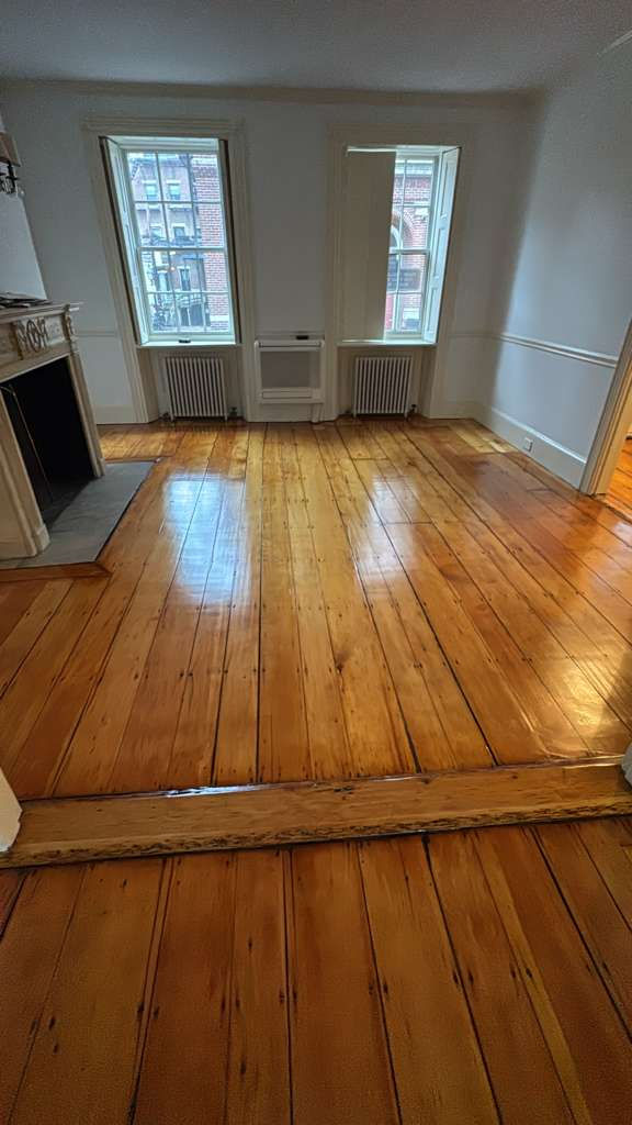 Refinished pine wood floors in Downtown Boston with 3 coats of Absco finish.