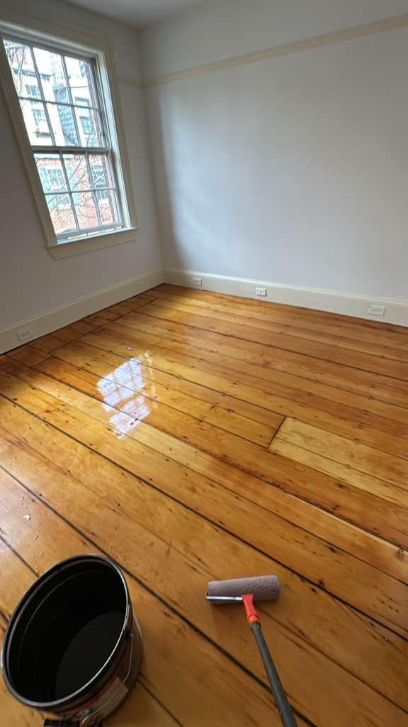 Refinished pine wood floors in Downtown Boston with 3 coats of Absco finish.