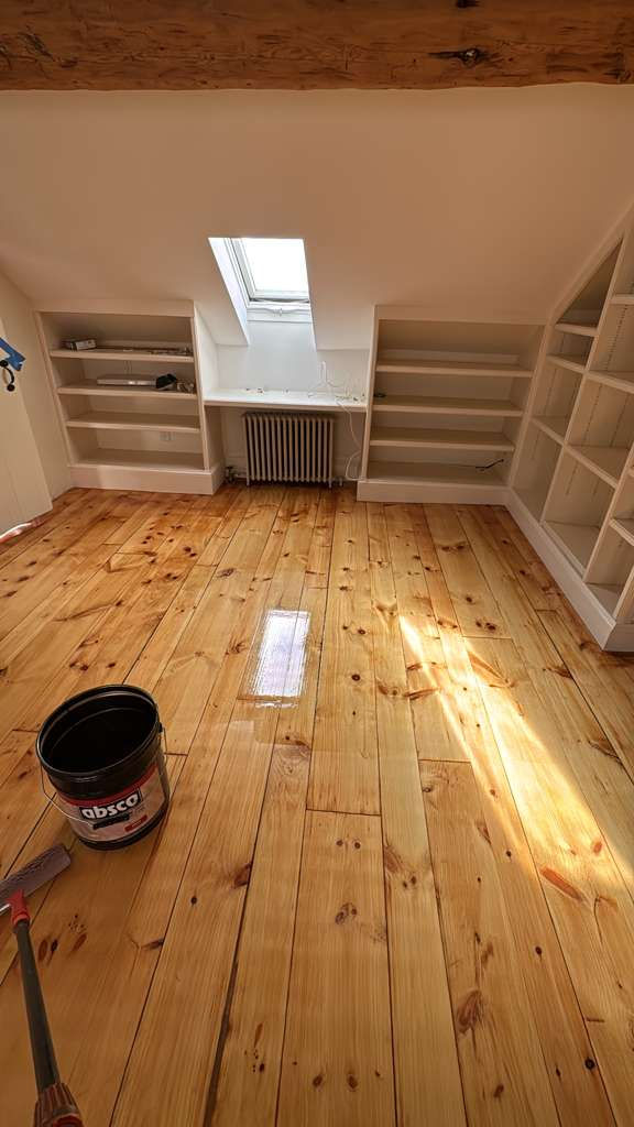 Refinished pine wood floors in Downtown Boston with 3 coats of Absco finish.