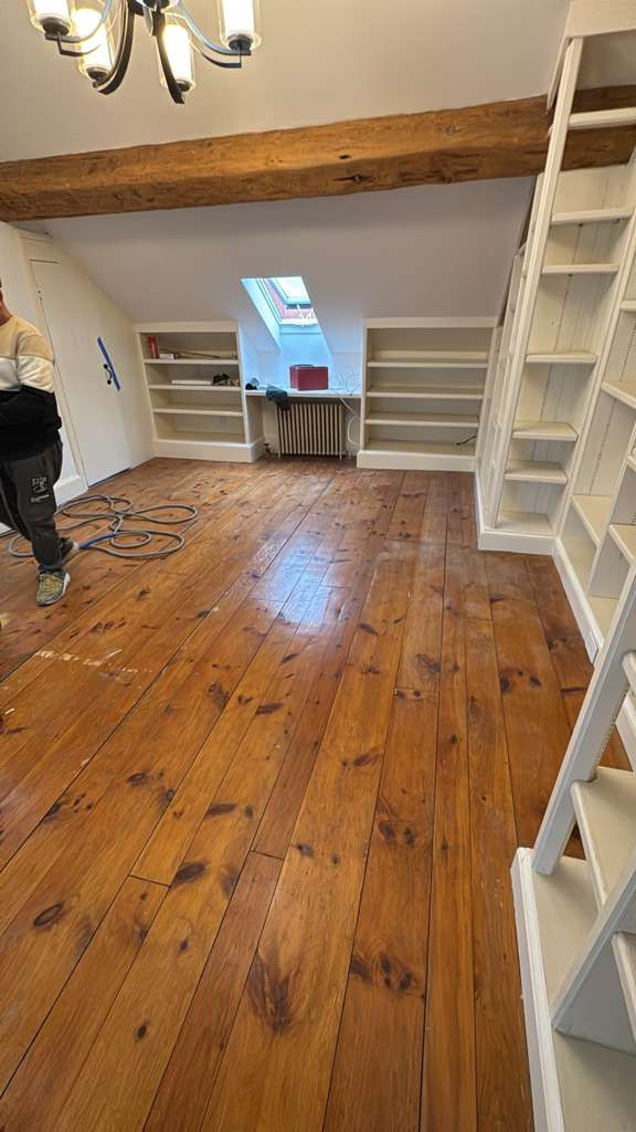 Refinished pine wood floors in Downtown Boston with 3 coats of Absco finish.