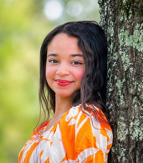 Voice , Early Childhood and Piano female instructor at Kingwood Arts Academy of Music in Kingwood Texas. She has black long hair and is smiling to the camera.