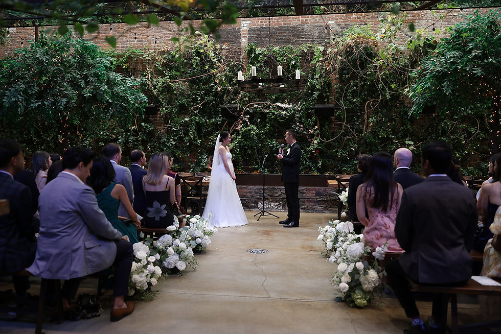 Couple standing in aisle getting married