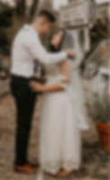 Groom lifting the bride’s veil