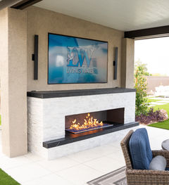 Outdoor fireplace Las Vegas installation with mounted 86 inch TV