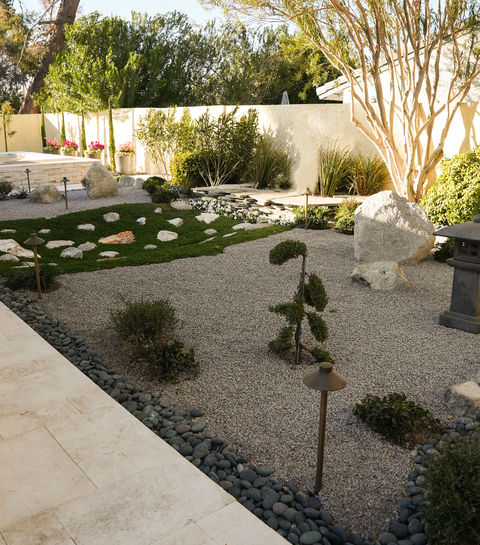 Serene Japanese garden design: rocks, gravel, and evergreens