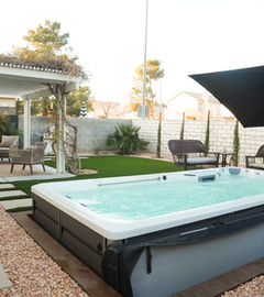 Relaxing backyard spa with patio furniture